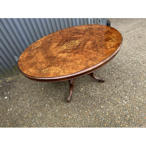 197 - A Victorian inlaid walnut oval loo table  134x100