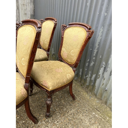 198 - A set of four Victorian mahogany dining chairs with gold pattern upholstery