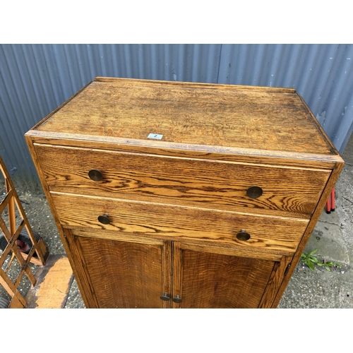 2 - An early 20th century oak two drawer tallboy 88x48x130