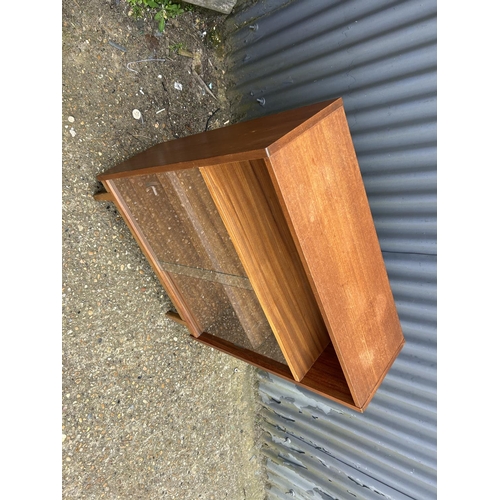 207 - A mid century glazed teak bookcase 77x28x95