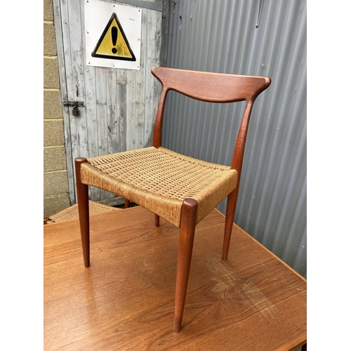 214 - A Danish teak drawer leaf extending dining table 100x100x72 together with three chairs - chairs mark... 