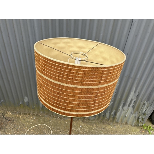 216 - A mid century teak standard lamp with shade