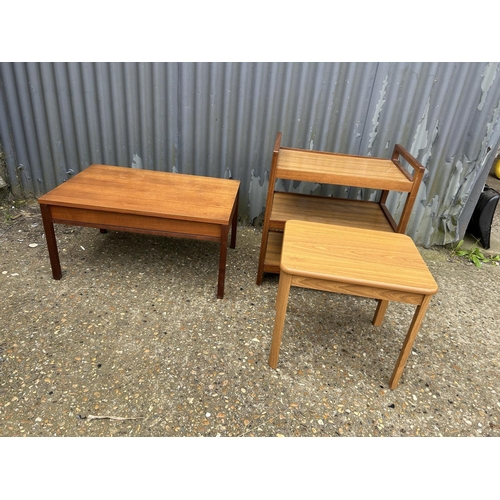 217 - A teak coffee table with drawer together with tea trolley and small occasional table