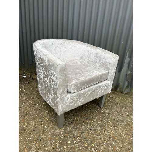 219 - A silver crush velvet tub shaped chair