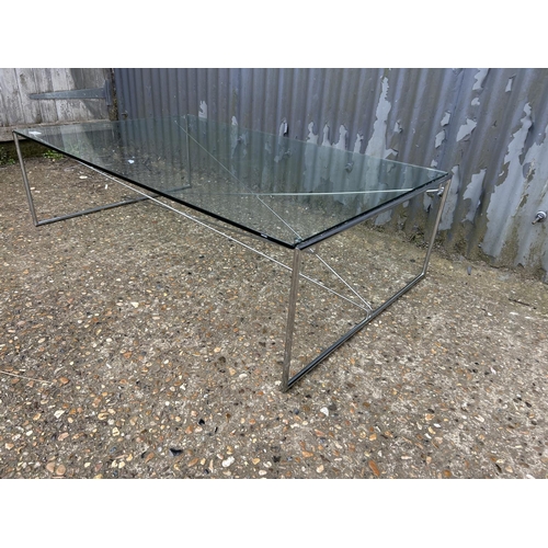 220 - A modern glass and steel coffee table 124x75x36