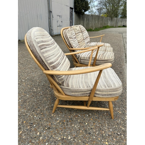 23 - An ercol light elm sofa and armchair