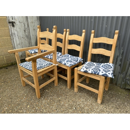 234 - A set of five modern solid pine dining chairs with rush seats