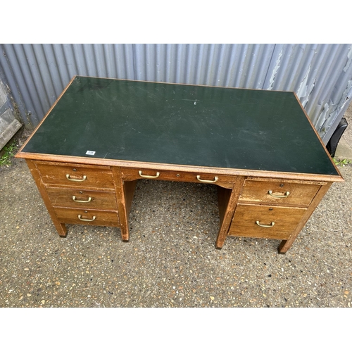 238 - An early 20th century desk with green leather top and brass handles 152x86x72