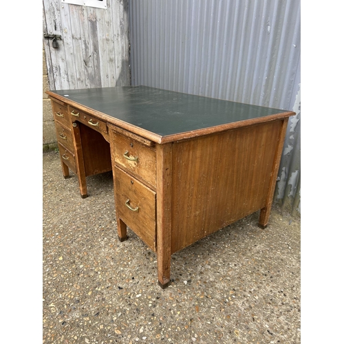 238 - An early 20th century desk with green leather top and brass handles 152x86x72