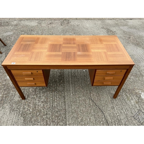 24 - A mid century teak kneehole desk labelled MADE IN NORWAY 150x77x74