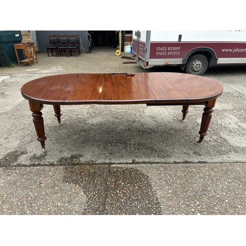 248 - A Victorian mahogany oval extending dining table with three leaves, extending to a maximum of 238x12... 