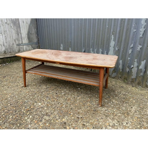 27 - A teak coffee table