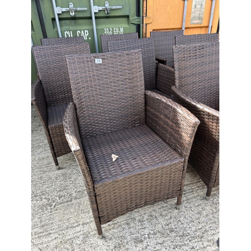 279 - A set of 8 modern rattan garden chairs with cushions (as new)