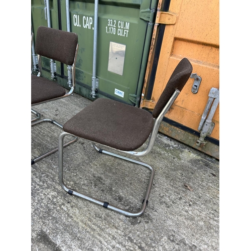 286 - A set of four mid century brown upholstered chrome cantilever chairs