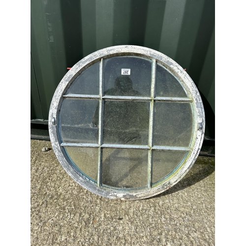 287 - A vintage aluminium framed circular window 70cm