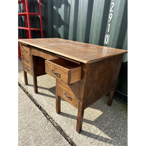 308 - A early 20th century oak typist desk  137x77x76