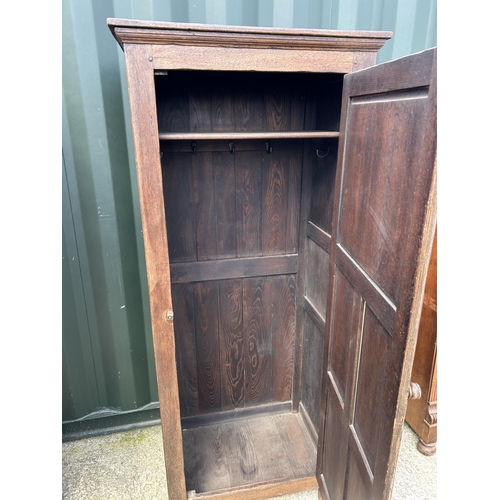 315 - A carved oak single door wardrobe 69x45x180