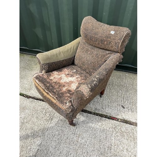 325 - An Edwardian country house style armchair for re upholstery