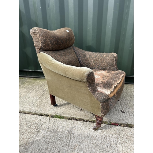 325 - An Edwardian country house style armchair for re upholstery