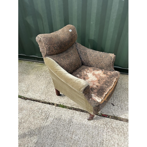 325 - An Edwardian country house style armchair for re upholstery