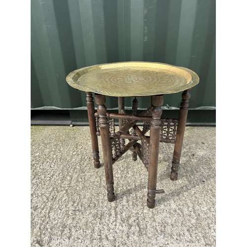 329 - A brass tray top table on folding base