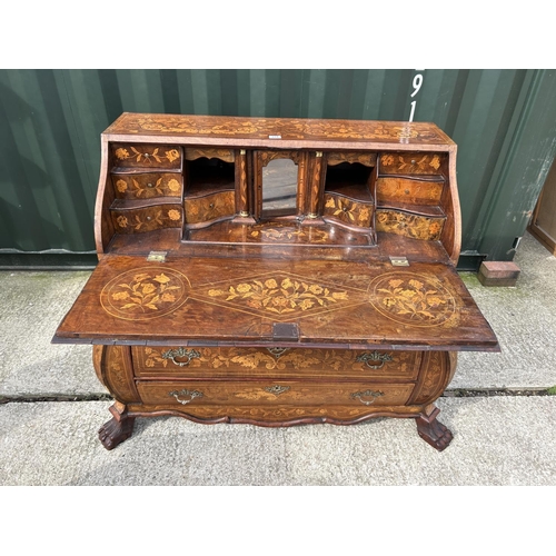 331 - An early Dutch marquetry inlaid bureau with fitted interior writing well and three long drawers rais... 