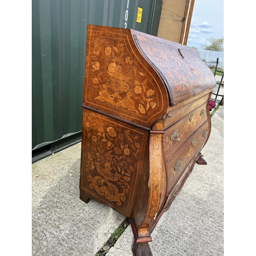 331 - An early Dutch marquetry inlaid bureau with fitted interior writing well and three long drawers rais... 