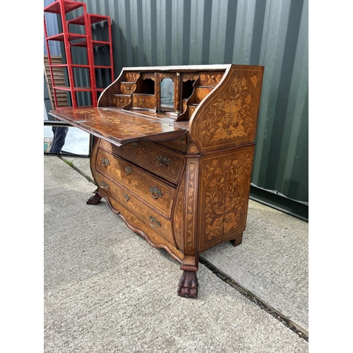 331 - An early Dutch marquetry inlaid bureau with fitted interior writing well and three long drawers rais... 