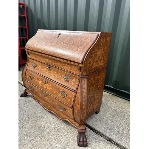 331 - An early Dutch marquetry inlaid bureau with fitted interior writing well and three long drawers rais... 