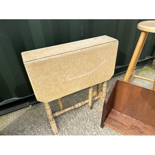 335 - A Sutherland table, book rack, basket and modern stool