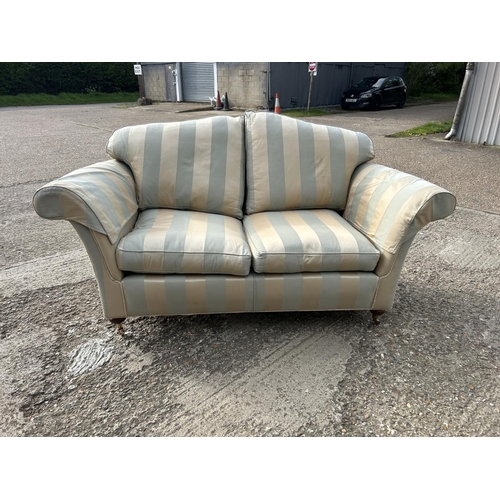 351 - A good quality green and gold striped two seater sofa by DURESTA