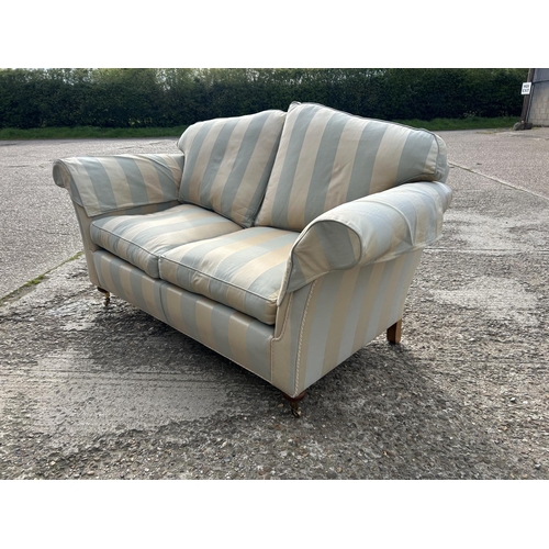 351 - A good quality green and gold striped two seater sofa by DURESTA