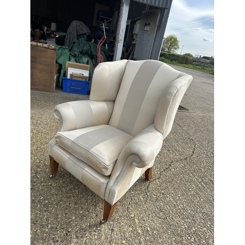 352 - A good quality cream striped wing back armchair by Duresta