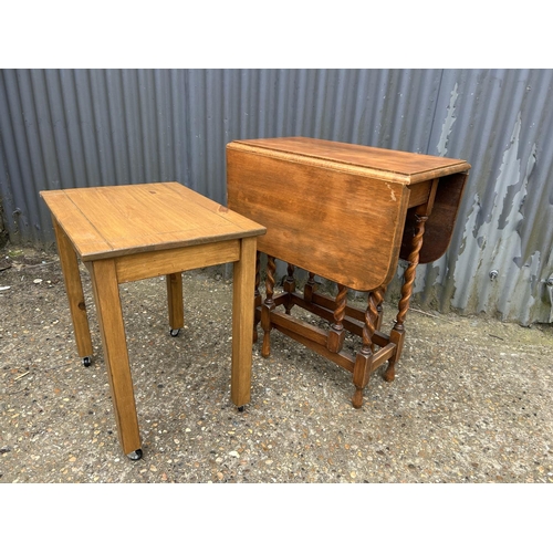 47 - An oak barley twist gate-leg table together with a small pine table