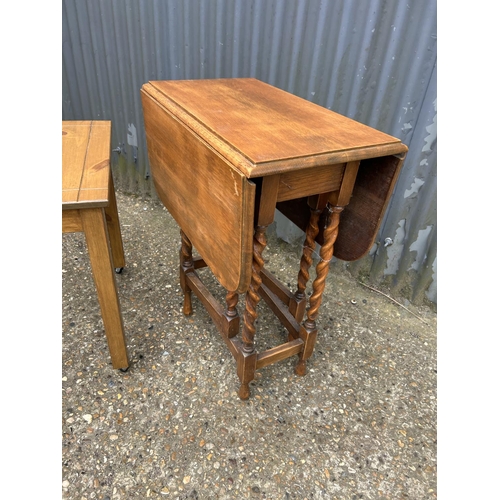 47 - An oak barley twist gate-leg table together with a small pine table