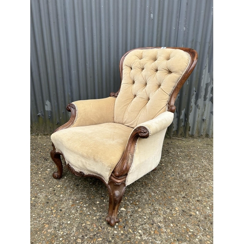 50 - A Victorian gold upholstered  button back nursing chair