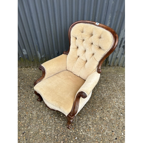 50 - A Victorian gold upholstered  button back nursing chair