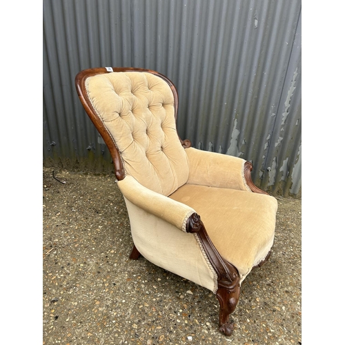 50 - A Victorian gold upholstered  button back nursing chair