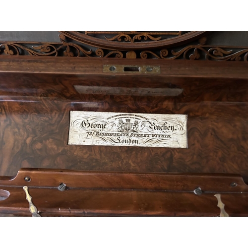 50a - An ornate walnut cased upright Piano by GEORGE BEACHEN London