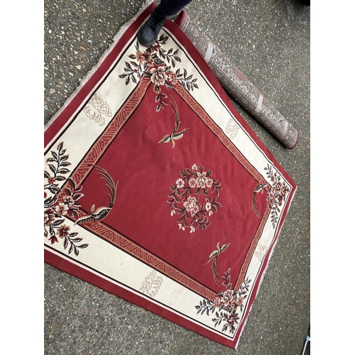 57 - Two large red pattern rugs