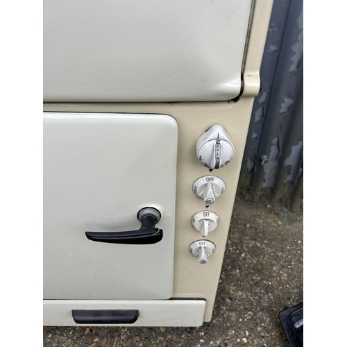 6 - A vintage cream enamel belling electric cooker