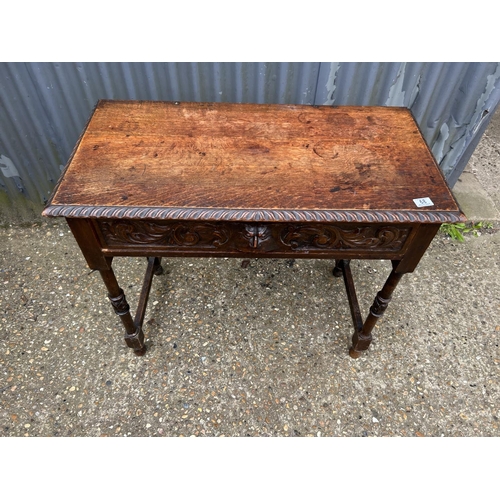 68 - A carved oak single drawer table 92x45 x80