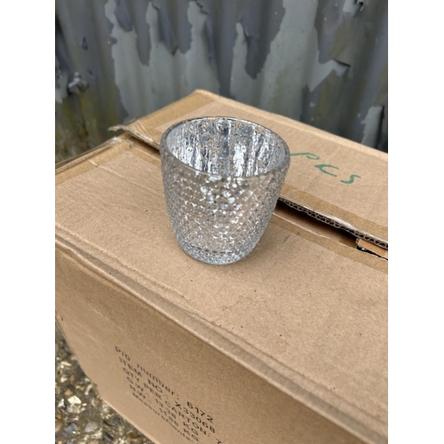 73 - A box of 72 silver glass tea lights