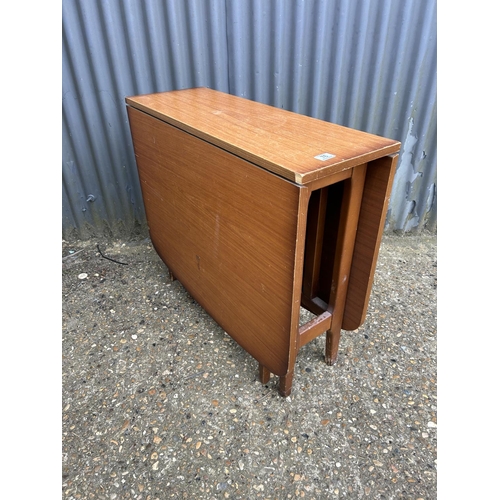 76 - A teak gate-leg table