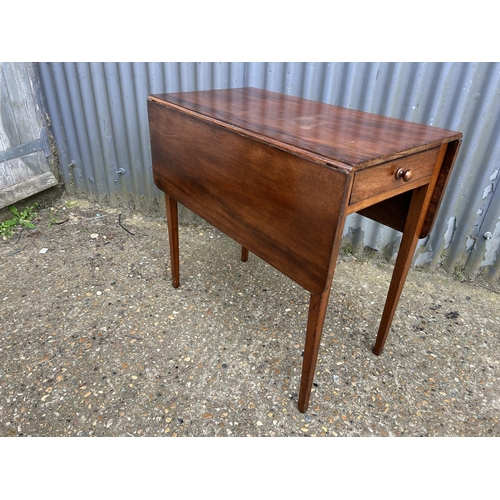 77 - A mahogany Pembroke table with drawer