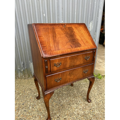 84 - A reproduction mahogany two drawer bureau