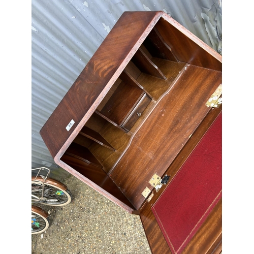 84 - A reproduction mahogany two drawer bureau