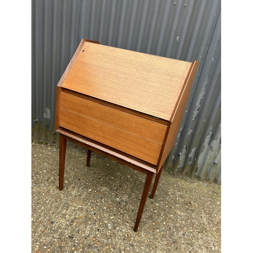 9 - A retro teak two drawer bureau with key