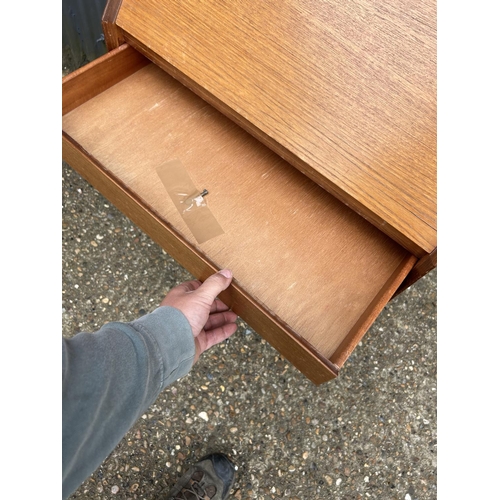 9 - A retro teak two drawer bureau with key