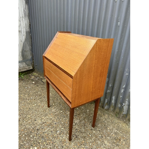 9 - A retro teak two drawer bureau with key